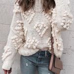 Chicwish Knit Your Love Heart Pom Turtleneck Sweater in White Photo 0