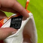 SheIn Orange and white hibiscus going out top/ halter top from Photo 3