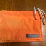 adolfo dominguez orange pouch makeup bag clutch stylish functional trendy Photo 0