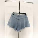 Free People  Harlie Denim Shortie in Mirage Fray Blue Flared Denim Shorts Size 28 Photo 5