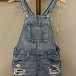 American Eagle  light wash distressed denim short overalls size small Photo 0