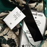 Betsy and Adam . Layla Halter Top Foil Print Gown. Photo 14