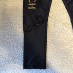 Warner Bros Black and Gold Leggings with Tapered Design Size XS Photo 4