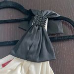 Women size S small One shoulder ivory top with black bow and crystals Photo 1