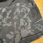 Athleta  Black Floral Print Running Shorts Women's Medium Athletic Workout Gym Photo 1