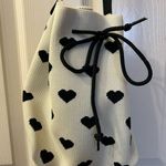 Cross body white with black hearts purse Photo 0