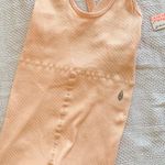Free People Movement Peach Ribbed onesie M/L Orange Size undefined Photo 0