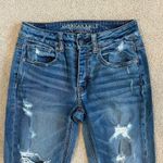 American Eagle Tom girl button front distressed blue jeans in size 0 Photo 1