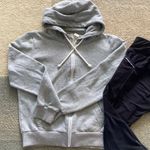 Athleta  black capri leggings, size small paired with H&M Hoodie S Photo 1