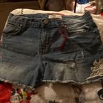 Stylish blue denim shorts with a trendy distressed look. Perfect for casual outings. Size 14 Photo 0
