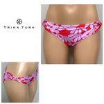 Trina Turk New. red and lilac twist side bikini bottom. 8. Retails $79 Photo 9