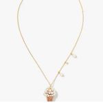 Kate Spade Carnival pendant showcases a faux pearl-embellished popcorn charm. Photo 2