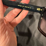 Gucci GG1714S cat-eye sunglasses with a black frame and solid grey lenses Photo 9