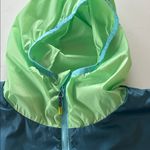 Cotopaxi  Women's Green and Blue Windbreaker Raincoat M Zip up Hooded Photo 1