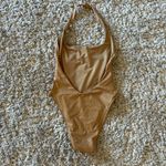 Vitamin A  Gold One Piece Photo 2