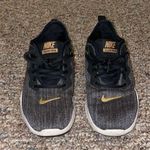 Nike Womens Flex TR9 Black with Gold Athletic Sneakers Shoes Photo 0