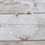 Very Light Shade of Rose Gold Tone Knot Bracelet Photo 3