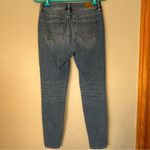 American Eagle  The Dream Jean High Rise Distressed Jegging Size 0 Short Photo 1