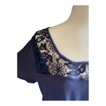 Torrid NWOT- Beautiful navy blue babydoll top with lace neckline and lace hem, excellent condition, size 2x Measurements: Bust: armpit to armpit 22 inches Length: shoulder seam to bottom 28 inches Photo 3