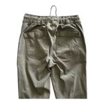 American Eagle -ARMY GREEN JOGGER PANTS-SIZE 2 Elastic waist with drawstring, zip front, two front and two back pockets, elastic ankles with a side zipper, excellent condition Measurements: Waist: side to side 13-16 inches Rise: 9 inches Inseam: 37 inches Photo 9