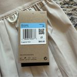 Nike NWT-  24.7 PerfectStretch
Women's Dri-FIT High-Waisted Loose Pleated Shorts Photo 1