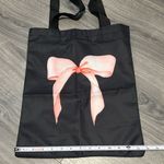 Black Tote Bag with Pink Bow Design Photo 1