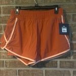 Stylish Women's Athletic Shorts in Rust by Nike Orange Size L Photo 0