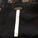 Free People floral embroidered, flowy tank top with strappy zip up back Photo 7