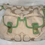 Coach  hobo-style crossbody purse, beige signature with green leather trim. Photo 2