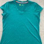 Xersion women’s athletic top short sleeves V neck turquoise blue size Medium Photo 0