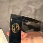 Gucci GG1714S cat-eye sunglasses with a black frame and solid grey lenses Photo 10