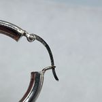 Boutique Sterling silver hoops simple round bar locking. Photo 3