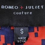 Romeo + Juliet Couture romper in orange and navy. Photo 4