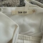 San Joy  Deep V Neck Low Cut Asymmetrical Ruffle Romper Dress in white Photo 6