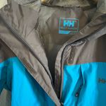 Helly Hansen  Women’s Tech Packable Hooded Rain Jacket Coat Outdoors Hiking Photo 4