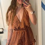 polka dot halter neck romper play suit in burnt orange Photo 1