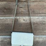Gray suede Crossbody purse with gold loop and chain details Photo 0
