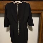 H&M Elegant Black Dress with Gold Chain Detail Photo 1
