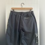 Nike  Sportwear Icon Clash Pants in Black Zippered Leg Pocket Detail Size M Photo 8