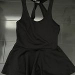 Sparkle & Fade Black Peplum Top With Cutout Back Photo 0