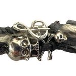 Light Gray and White Skull with Music Note Multi Strand String Bracelet Photo 1