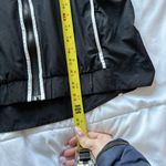 Nike  Womens Size Large Windbreaker Sportswear Windrunner Black White Hooded Photo 4