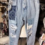 Simple Society PREMIUM Fabric AUTHENTIC denim patches jeans pants 9/29 NWT New with tag  Same day shipping  Smoke and pets free  Elevate your denim game with these premium  jeans. Crafted with authentic denim and stylish patches, these straight leg jeans feature a comfortable zip and button closure, as well as practical pockets. The distressed details and cropped length add a trendy touch to this classic wardrobe staple.   Perfect for any casual occasion, these jeans are a must-have for any fashion-forward woman. Available in size 29 and with tags still attached, these jeans are brand new and ready to be added to your collection. Get your hands on these  premium denim jeans today! Photo 3