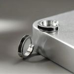 Sterling Silver NIB -  925 Black & Silver Huggie Hoop Earrings. Photo 1