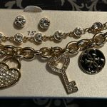 Guess lose angels bracelet with matching earrings set Photo 3