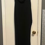 Black cocktail dress. Slit on the left leg mid thigh. Size small Photo 0