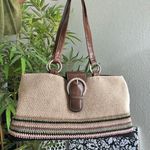 Cute 90s beige cream tan khaki crochet bag with a brown green pink stripes shoulder hand bag purse and buckle detail. Photo 0