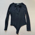 reoria. Deep V Neck Bodysuit Photo 1