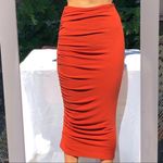 Alice + Olivia  | Mindie Ruched Midi Fitted Skirt in Rust Terracotta Photo 2