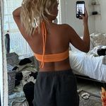 Orange Teri Cloth Halter Crop Photo 2